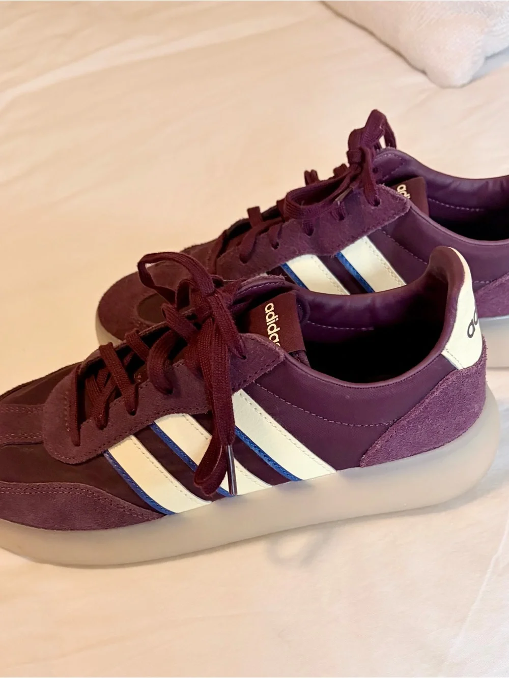 adidas burgundy and white suede sneakers with blue stripe accents